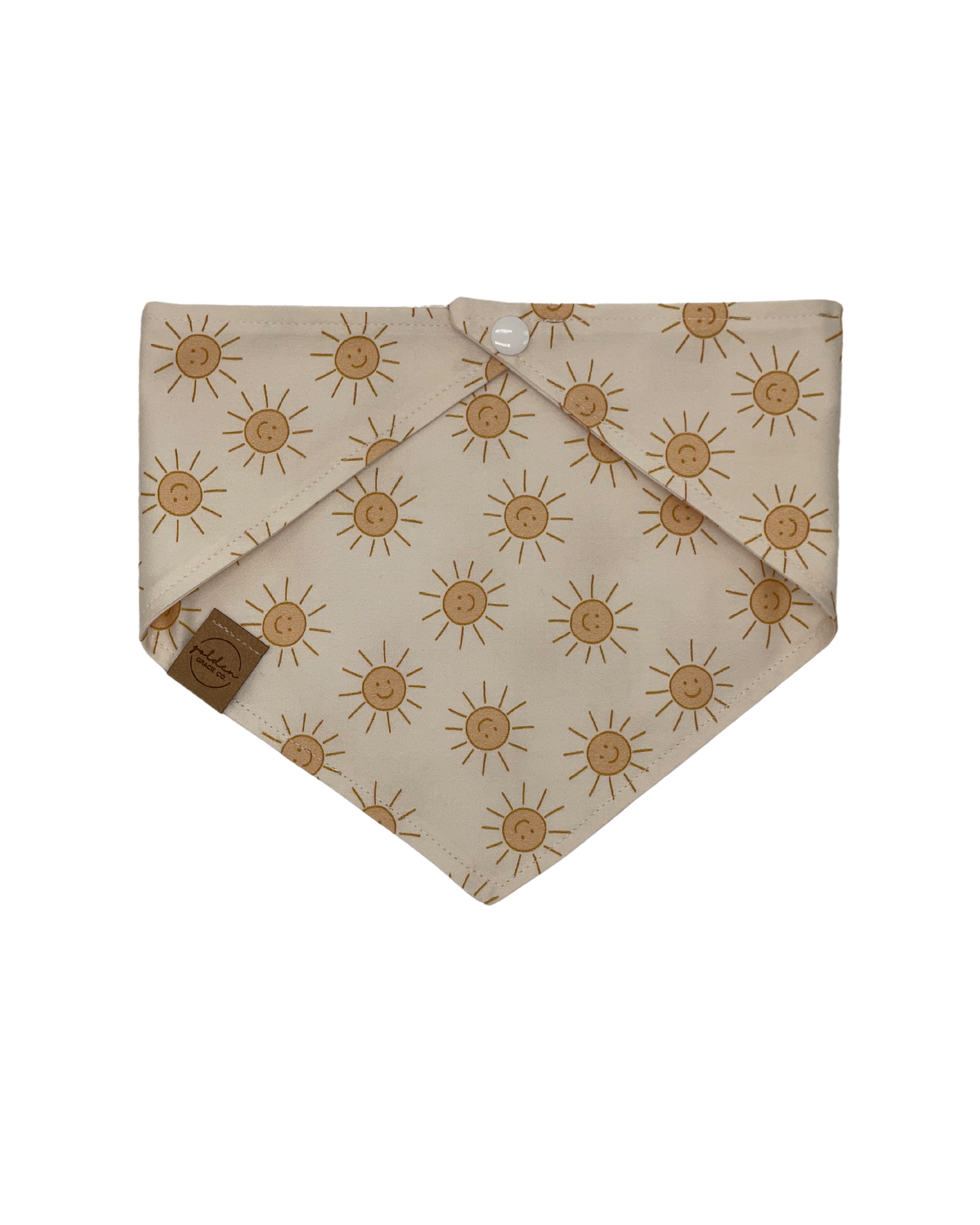 cream colored pet bandana patterned with smiling yellow suns