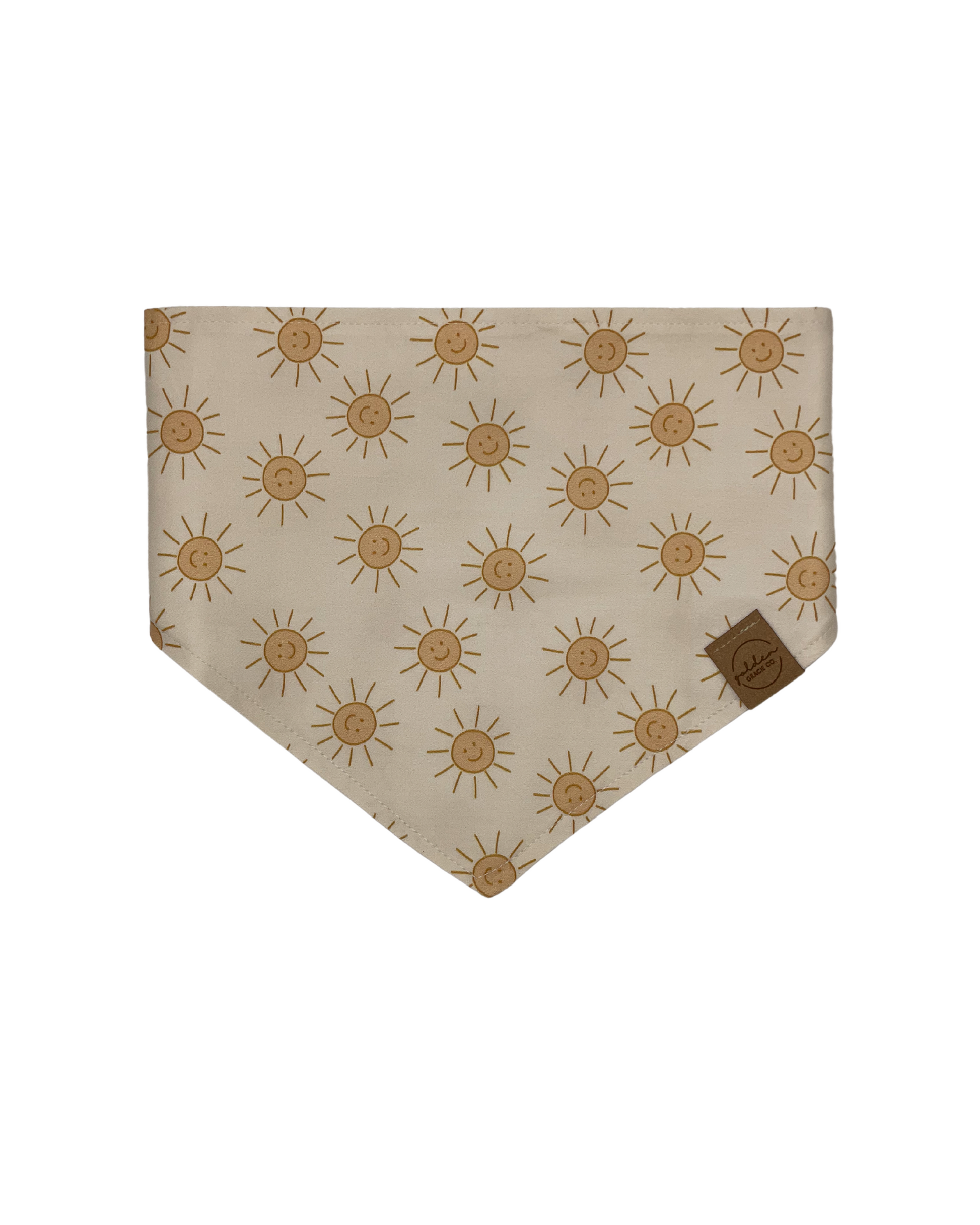 cream colored pet bandana patterned with smiling yellow suns