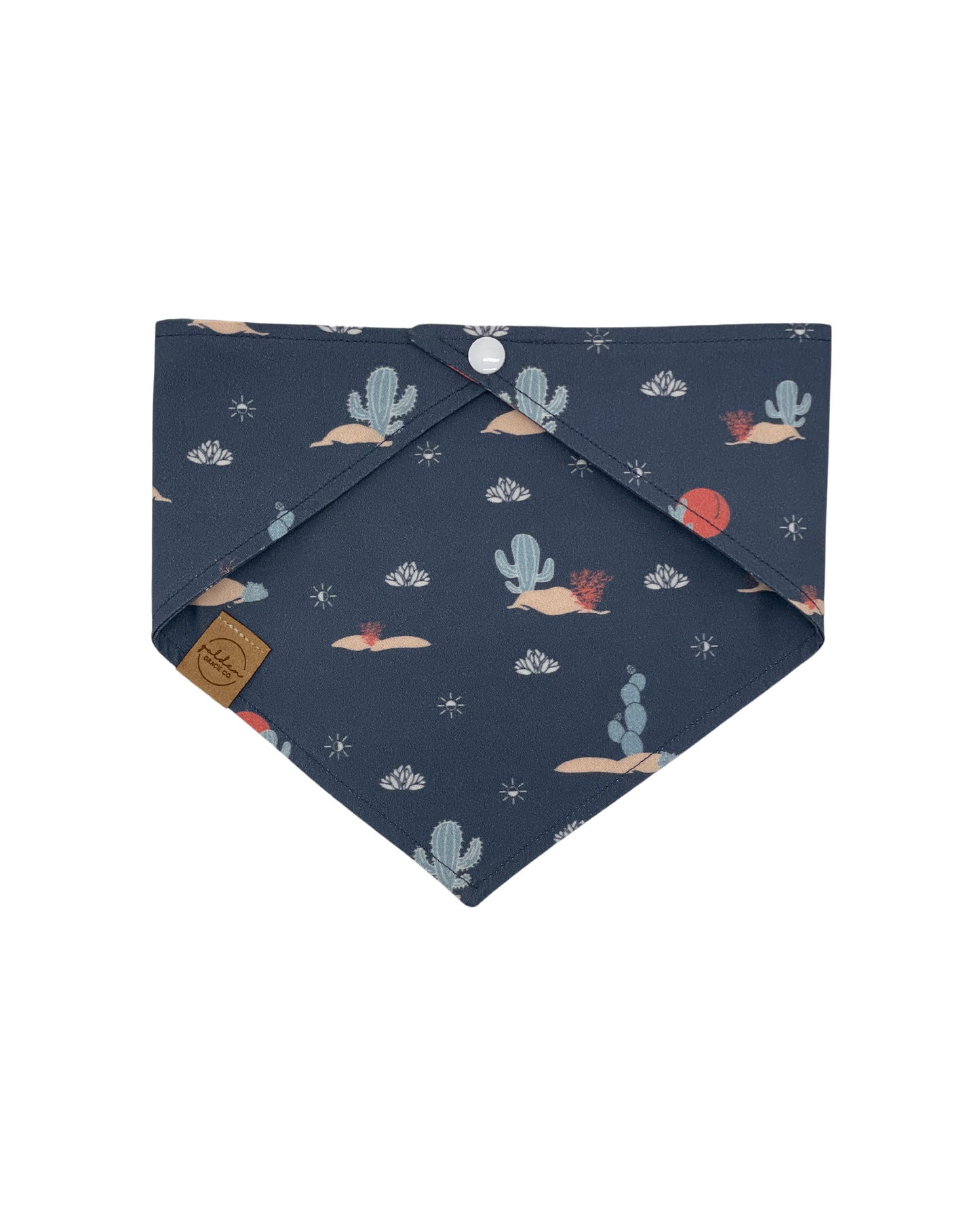 back of navy blue pet bandana featuring cacti and a desert theme