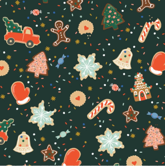 Pattern of Christmas-themed cookies and candies on a dark green background 